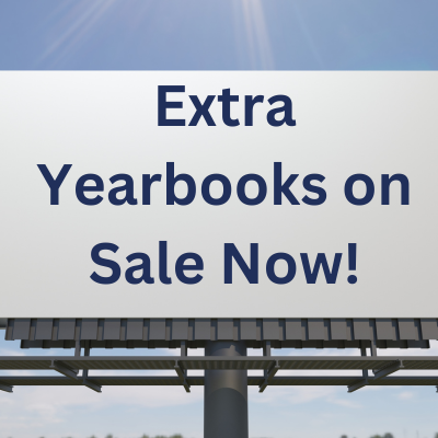 Billboard against a blue sky with the text “Extra Yearbooks on Sale Now!”.
